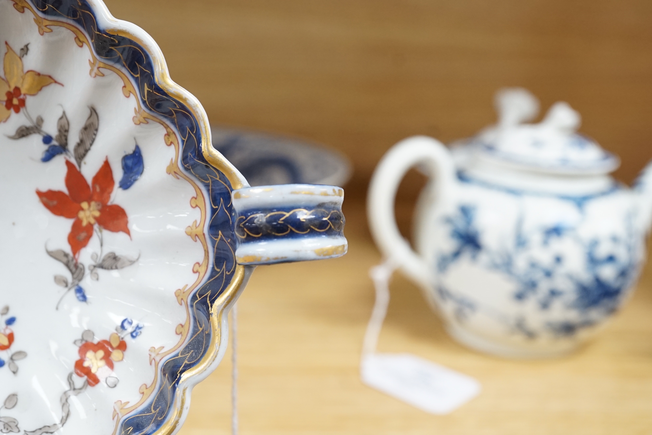 A Chinese blue and white ‘dragon’ dish, marked to base, 28cm diameter, together with a Samson blue and white ground serving dish with gilt decoration